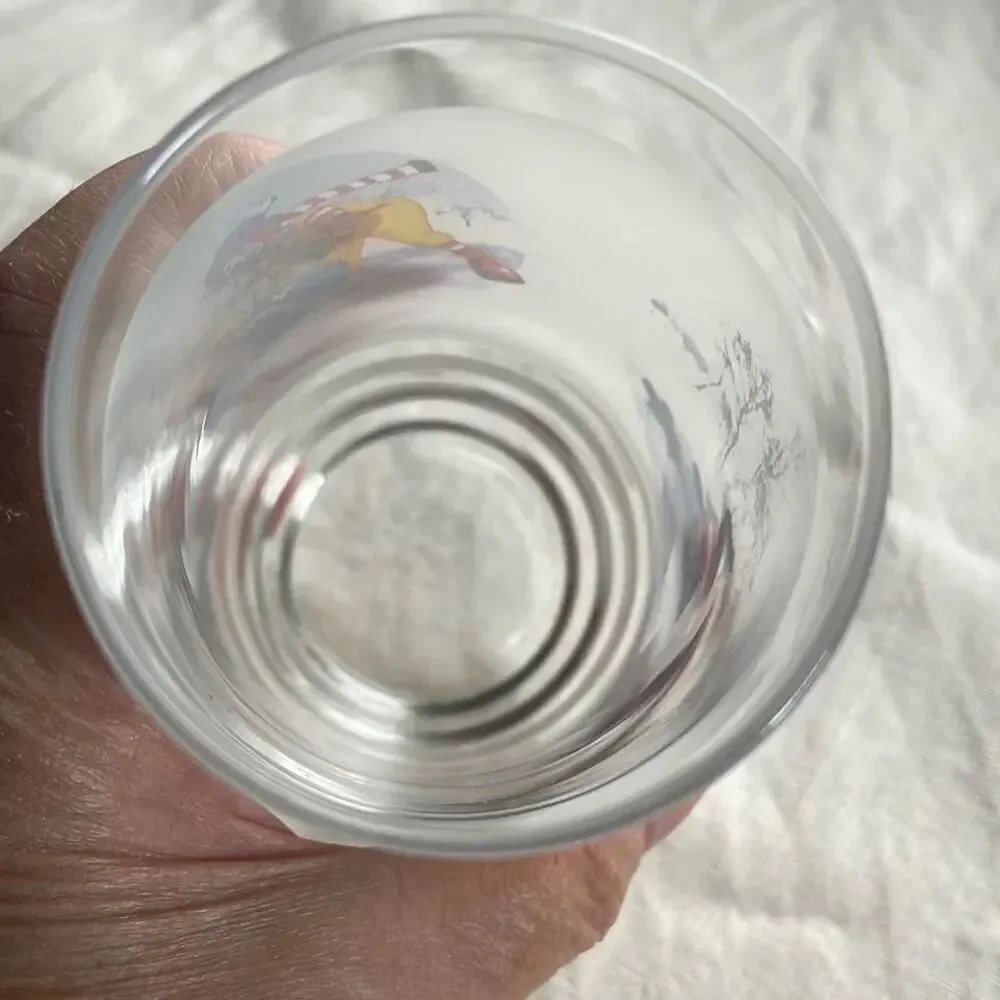 Vintage Ronald McDonald winter sled scene glass.